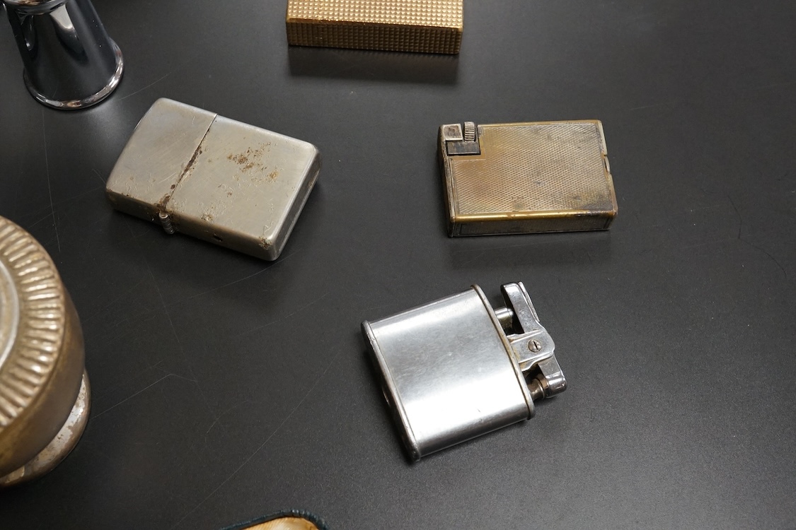 Ten assorted lighters including two Dunhill examples, a Ronson and Dupont, largest 12cm high
